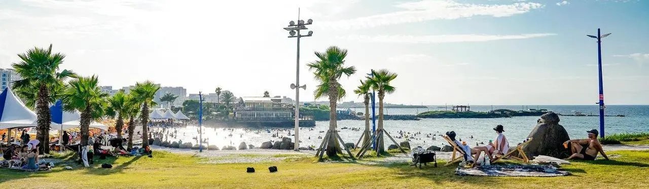 Hamdeok Beach with calm shallow water