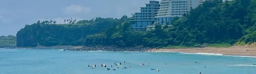 Jungmun Saekdal Beach with rolling waves