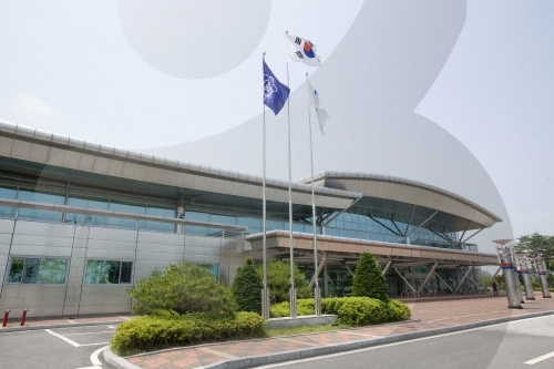 Dorasan Station — modernist station building with South Korean and UN flags