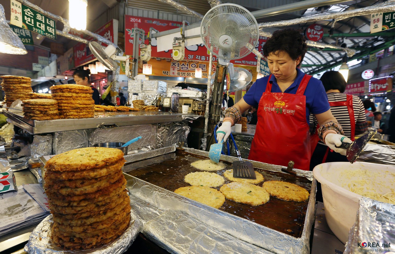 Gwangjang Market food stall alley — bindaetteok pancakes, mayak gimbap, and Seoul's oldest street food market