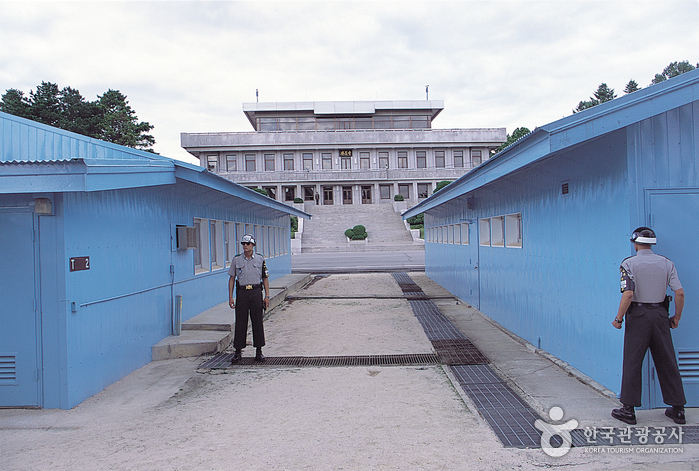 Panmunjom Joint Security Area — blue UN buildings with North Korean Panmungak in background